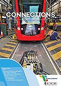 Newsletter cover showing the front of a Citadis tram in the maintenance barn with equipment in front and a maintenace worker to the right.